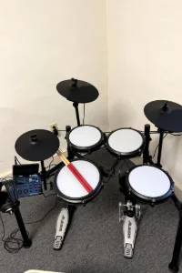 The student drum set in the practice room