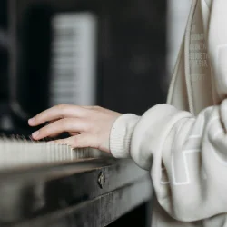 Image of a child practicing piano