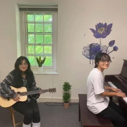 Image of two friends playing a duet at Downingtown Music Academy's summer music camp